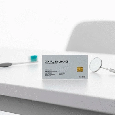 Close-up of a dental insurance card on a desk